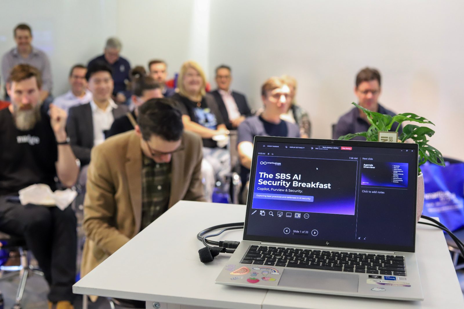 Smart Business Systems AI Security Breakfast presentation with a room of guests